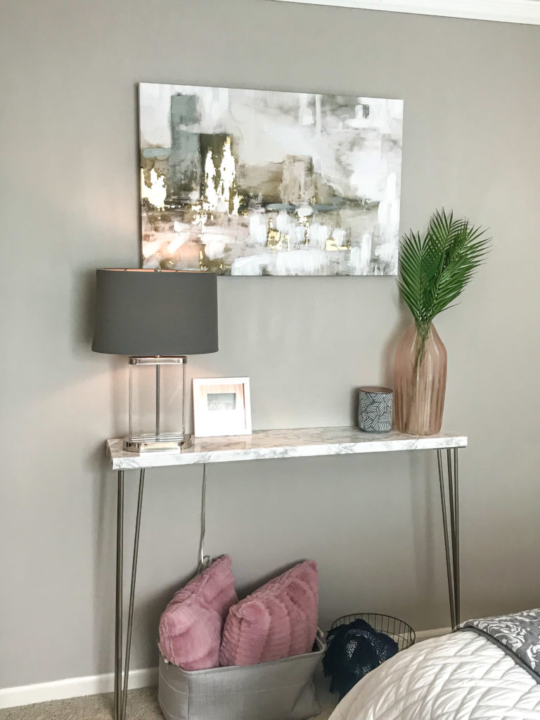 This super easy faux marble console table only takes 20 minutes to complete and instantly adds a touch of glam to your living space without breaking the bank! Check out these simple, easy-to-follow instructions!