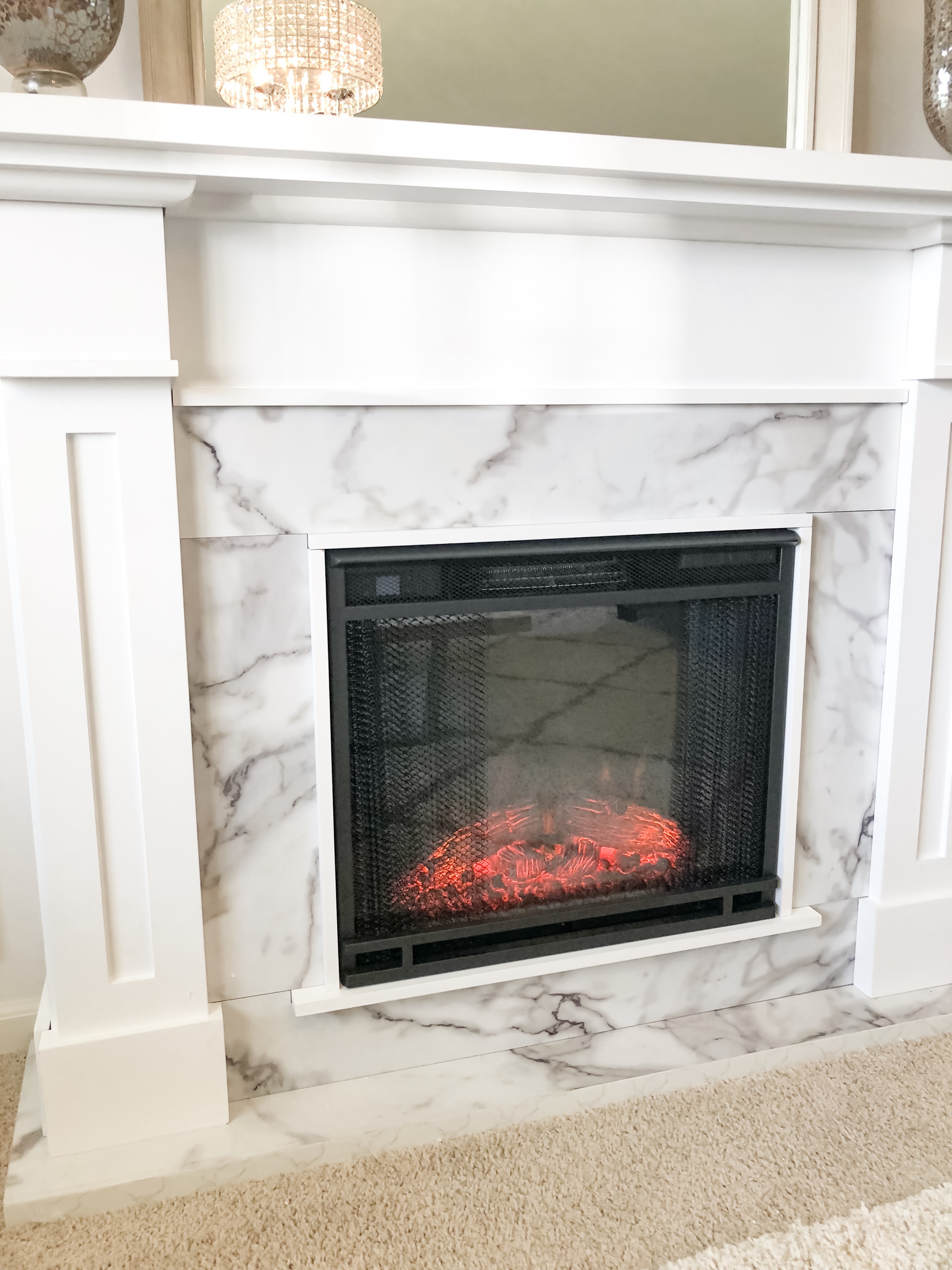 No fireplace? No problem! See how I was able to easily add a fireplace to my space without hiring someone to install one! 